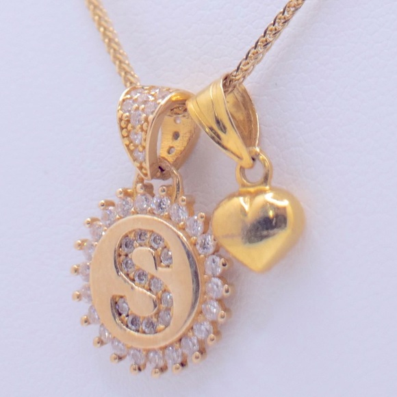 “S” pendant surrounded by white stones with a small heart charm. - Picture 2 of 3